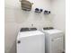 Laundry room features a side-by-side washer and dryer at 648 White Birch Ln, Angier, NC 27501