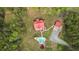 Aerial view of the secluded home with pool, surrounded by lush greenery at 6707 Frieden Church Rd, Gibsonville, NC 27249