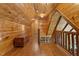 Hallway features wood paneling, wooden chest, wood railings, and hardwood floors at 6707 Frieden Church Rd, Gibsonville, NC 27249