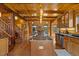 Kitchen with wooden cabinets, wood floors, stainless steel appliances and a view of the dining room at 6707 Frieden Church Rd, Gibsonville, NC 27249