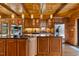 Gourmet kitchen features custom wood cabinets, stainless appliances, and a large center island at 6707 Frieden Church Rd, Gibsonville, NC 27249