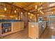 Well-lit, open kitchen featuring wooden accents, granite countertops, and stainless steel appliances at 6707 Frieden Church Rd, Gibsonville, NC 27249
