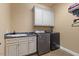 Laundry room with cabinetry, a sink, washing machine and dryer at 6707 Frieden Church Rd, Gibsonville, NC 27249