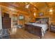 Spacious main bedroom with wood accents, a sitting area, and ensuite bath at 6707 Frieden Church Rd, Gibsonville, NC 27249
