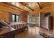 Spacious main bedroom with wood accents, a sitting area, and access to the porch at 6707 Frieden Church Rd, Gibsonville, NC 27249