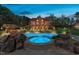 Beautiful log home featuring a swimming pool, jacuzzi, and an outdoor tiki bar surrounded by lush greenery at 6707 Frieden Church Rd, Gibsonville, NC 27249