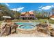 Gorgeous pool and spa with rock waterfall features, perfect for relaxation and entertainment at 6707 Frieden Church Rd, Gibsonville, NC 27249