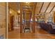 Interior view of wood staircase with wood railings that gives access to the downstairs and living spaces at 6707 Frieden Church Rd, Gibsonville, NC 27249