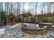 Beautiful outdoor space features a stone patio with gazebo and hot tub, perfect for entertaining at 7116 Asheway Dr, Holly Springs, NC 27540