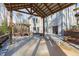 Patio and outdoor space with wooden structures, a hot tub and the house in the background at 7116 Asheway Dr, Holly Springs, NC 27540