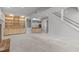 Finished basement features custom built-ins, wet bar, neutral carpet, and recessed lighting at 7116 Asheway Dr, Holly Springs, NC 27540