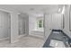 Spacious bathroom featuring a large soaking tub, step up, and glass shower at 7116 Asheway Dr, Holly Springs, NC 27540