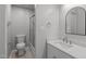 Clean bathroom featuring a modern vanity with a stone countertop and shower at 7116 Asheway Dr, Holly Springs, NC 27540