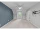Spacious bedroom with neutral carpet, a ceiling fan, and fresh paint at 7116 Asheway Dr, Holly Springs, NC 27540