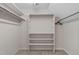 Walk-in closet with shelving and hanging rods at 7116 Asheway Dr, Holly Springs, NC 27540