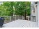 Wooden deck with views of the treed backyard, perfect for outdoor entertaining at 7116 Asheway Dr, Holly Springs, NC 27540