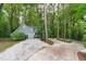 Inviting home with mature trees, circular driveway, and well-manicured landscaping at 7116 Asheway Dr, Holly Springs, NC 27540
