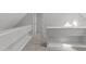 Open hallway with built-in shelves and carpet at 7116 Asheway Dr, Holly Springs, NC 27540