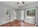 Cozy sitting room with hardwood floors, natural light, and access to outdoor areas at 7116 Asheway Dr, Holly Springs, NC 27540