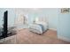 Bright bedroom features light blue walls, white trim, and a large window at 7516 Orchard Crest Ct, Apex, NC 27539