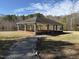 Outdoor community pavilion with seating and a scenic pathway at 7516 Orchard Crest Ct, Apex, NC 27539