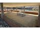 A community picnic pavilion with stone surround and views of the water at 7516 Orchard Crest Ct, Apex, NC 27539
