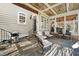 Charming covered patio with an outdoor grill and views of the backyard at 7516 Orchard Crest Ct, Apex, NC 27539