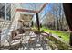 Backyard patio features an outdoor seating area and a view of the surrounding landscape at 7516 Orchard Crest Ct, Apex, NC 27539