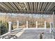 A spacious wooden deck with an awning overlooking the manicured backyard at 7516 Orchard Crest Ct, Apex, NC 27539