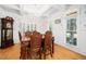 Formal dining room with wainscoting, hardwood floors, traditional furnishings and a chandelier at 7516 Orchard Crest Ct, Apex, NC 27539