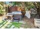 Backyard features a private hot tub with wood privacy fence and stone paver pathway at 7516 Orchard Crest Ct, Apex, NC 27539
