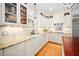 Bright kitchen featuring granite countertops, white cabinetry, and stainless steel appliances at 7516 Orchard Crest Ct, Apex, NC 27539