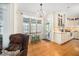 Bright eat-in kitchen features a chandelier and stainless steel appliances, perfect for Gathering meals and entertaining at 7516 Orchard Crest Ct, Apex, NC 27539
