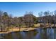 An expansive lakefront property with a private dock offering scenic views at 7516 Orchard Crest Ct, Apex, NC 27539