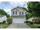 Charming two-story home with a well-manicured front lawn and attached two-car garage at 8908 Shallcross Way, Raleigh, NC 27617