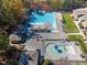 Aerial view of community pools with lounge areas, playgrounds, and meticulously landscaped grounds at 81008 Alexander, Chapel Hill, NC 27517