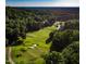 Aerial view of the golf course showing the surrounding wooded area at 81008 Alexander, Chapel Hill, NC 27517