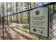 Community bark park with green space and shady trees, dedicated to dogs and their owners to socialize at 81008 Alexander, Chapel Hill, NC 27517
