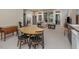 This carpeted basement space has a kitchenette, seating area, and direct access to the home office at 81008 Alexander, Chapel Hill, NC 27517