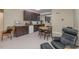 The basement kitchenette features wooden cabinets, a small dining table, and an adjacent seating area at 81008 Alexander, Chapel Hill, NC 27517