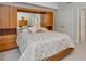 Bedroom with built-in wooden storage, mirrored headboard, and neutral carpet at 81008 Alexander, Chapel Hill, NC 27517