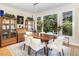 Bright dining room features lots of windows, hardwood floors, and space for entertaining guests at 81008 Alexander, Chapel Hill, NC 27517