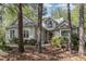 Charming home featuring light gray siding, a dark roof, and a beautiful arched window over the front door at 81008 Alexander, Chapel Hill, NC 27517