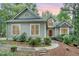 Charming one-story home features a well-manicured yard with mature landscaping and a welcoming entrance at 81008 Alexander, Chapel Hill, NC 27517