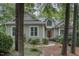Charming home featuring light gray siding, a dark roof, and a beautiful arched window over the front door at 81008 Alexander, Chapel Hill, NC 27517