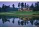 Distant view of the home and golf course reflecting in a lake at 81008 Alexander, Chapel Hill, NC 27517