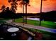 Stunning golf course view with lush green fairways and sunset, creating a serene and picturesque setting at 81008 Alexander, Chapel Hill, NC 27517