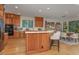 Kitchen with stainless steel appliances, island, wooden cabinets, and bar stool seating is great for a home cooked meal at 81008 Alexander, Chapel Hill, NC 27517