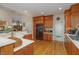 Well-equipped kitchen with wooden cabinets, updated appliances, and a breakfast bar provides ample space for cooking and meal preparation at 81008 Alexander, Chapel Hill, NC 27517