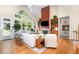 Spacious living room features a fireplace, built-ins, and large windows at 81008 Alexander, Chapel Hill, NC 27517